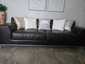 Long, sturdy brown leather couch