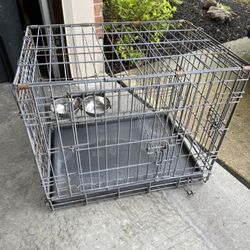 Small Dog Or Cat Crate With Food And Water Bowls. Size 24x19x20”.  
