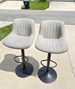 Selling 2 gray suede bar stools with adjustable height