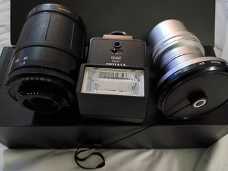 Camera lenses and a vintage flash