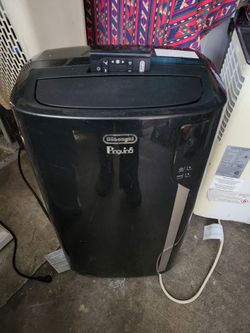 Aire acondicionado portable.  Se vende asi como esta en las fotos y el video.