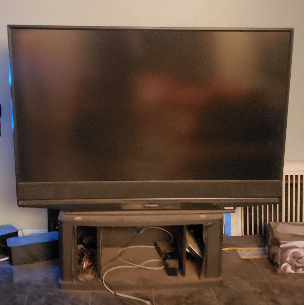 65 in tv Mitsubishi (not a flat tv) with stand