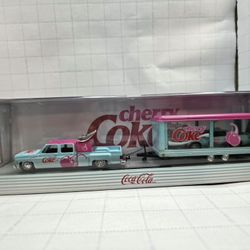 This is an M2 Machines Cherry Coke Auto Hauler diecast set, featuring a 1973 Chevrolet Cheyenne Super 30 and a 1985 Chevrolet Camaro IROC-Z