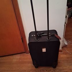 Black carry-on roller suitcase.