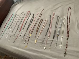 Catholic rosaries made primarily of glass, acrylic   , plastic, wood, and base-metal crucifixes.$15 each