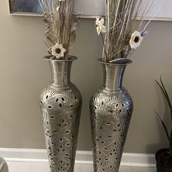 2 metal vases with flowers included