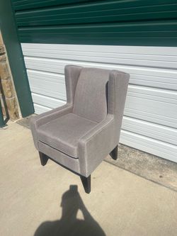 Gray Upholstered Wingback Chair