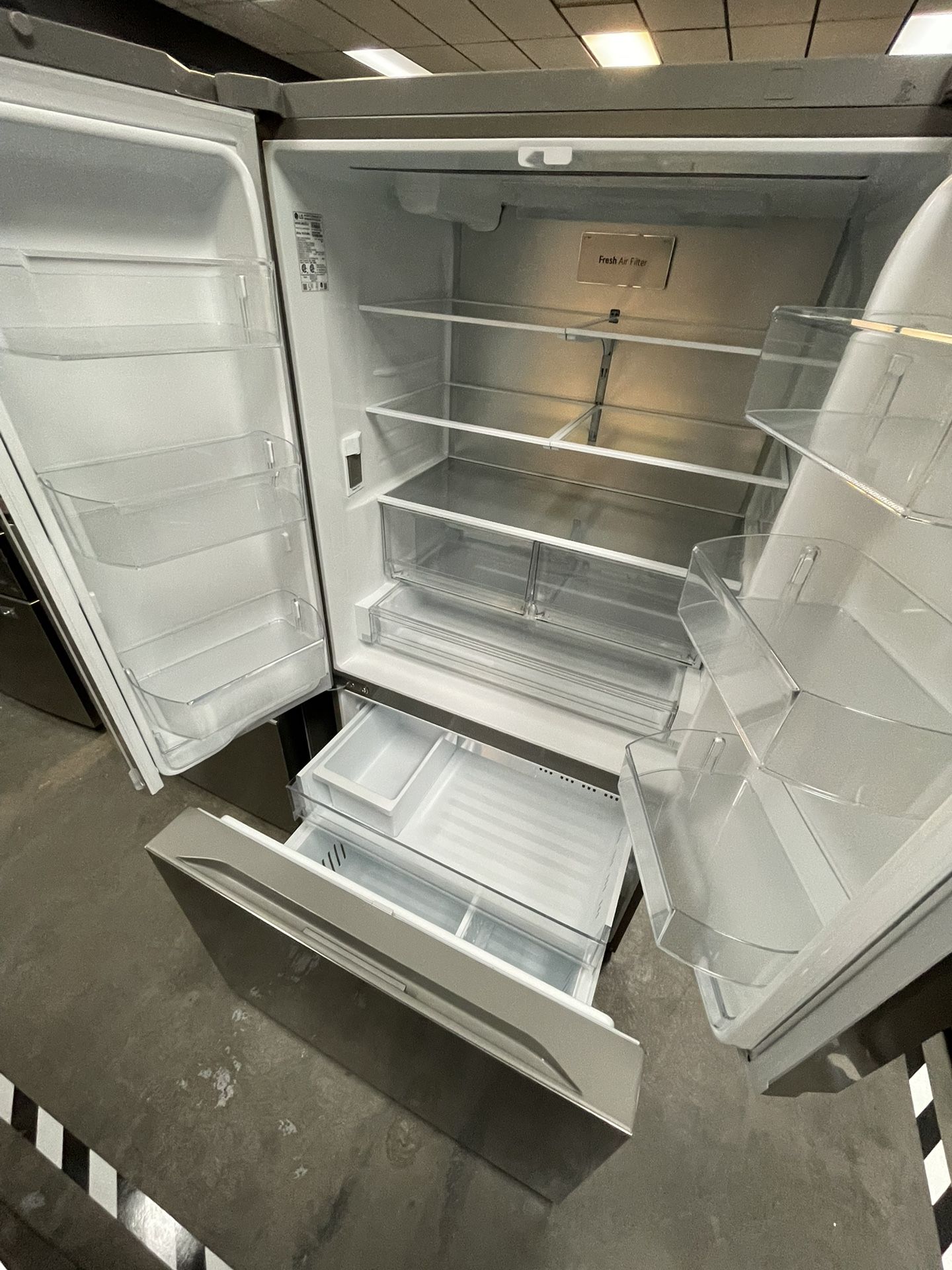LG Plain Face Refrigerator With Water And Ice Inside In Counter Depth