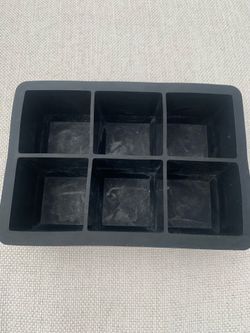 6-cavity black silicone ice cube tray, barely used.