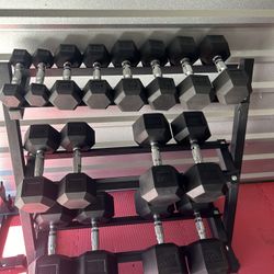 New pair of 5,10,15,20,25,35,45,55lb rubber dumbbells + rack. All new in box $495