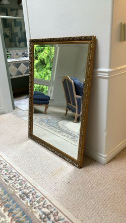 Beveled mirror with  ornate  frame