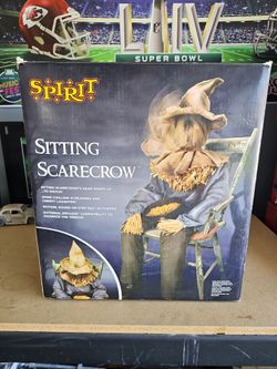 Halloween sitting scarecrow