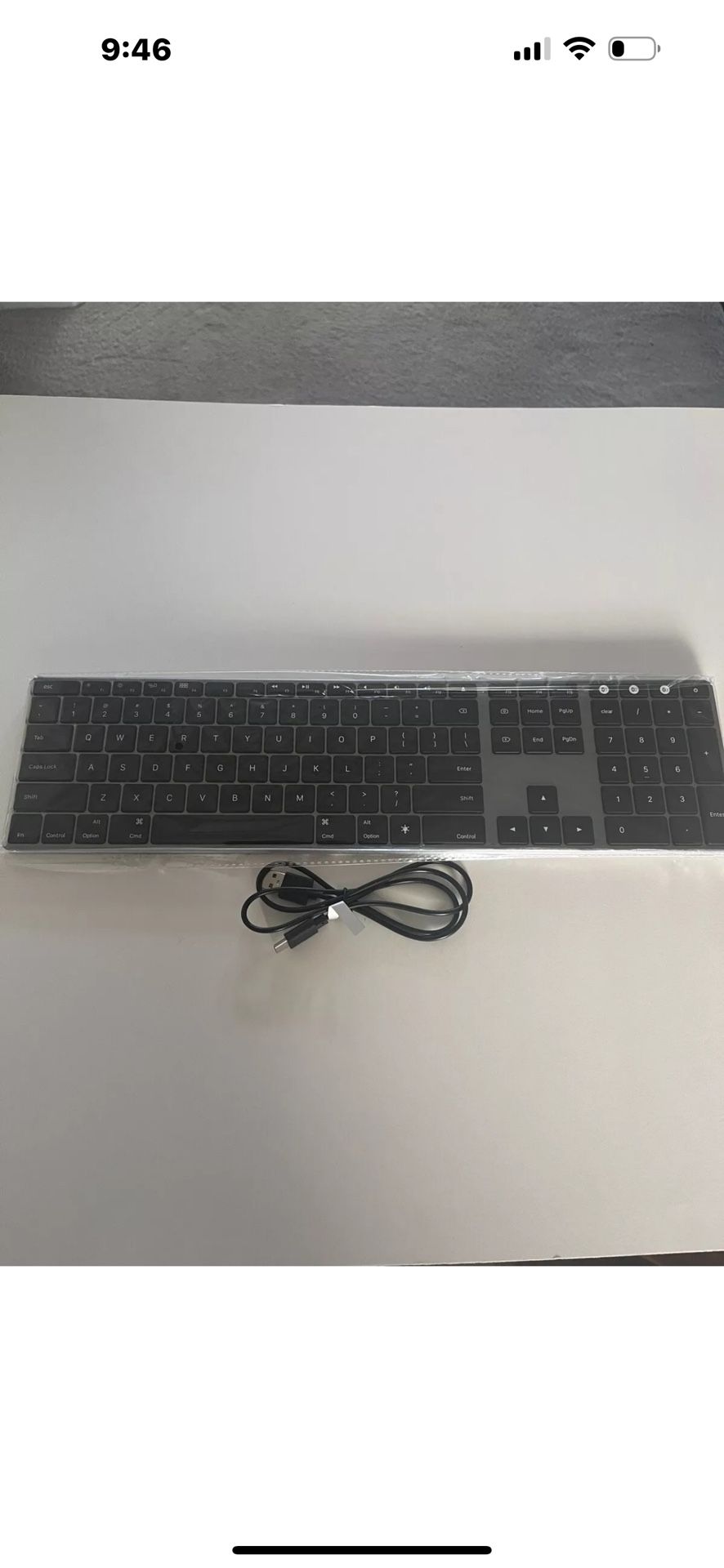 The Jelly Comb Wireless Multi-Device Keyboard is a slim, black keyboard designed for use with Mac computers.