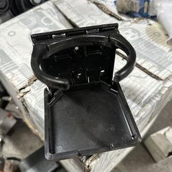 CUP HOLDER FOLD DOWN