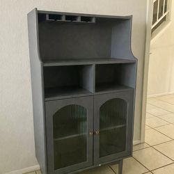 Sleek Blue-Gray Storage Cabinet in Minimalist Space
