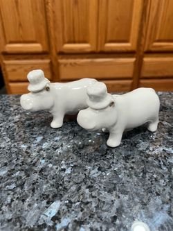 Ceramic White hippopotamus Pair of  Salt and pepper shakers .  Brand new never used .  Size approximately 4 inches long and 3 inches tall.   Has been 