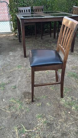 High wooden dining table with 6 chairs
