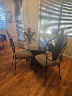 Glass top table with 4  Wrought Iron Dining Table with Chairs