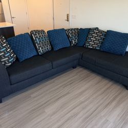 Gray Sectional Sofa With Reversible Cushions And RAF chaise