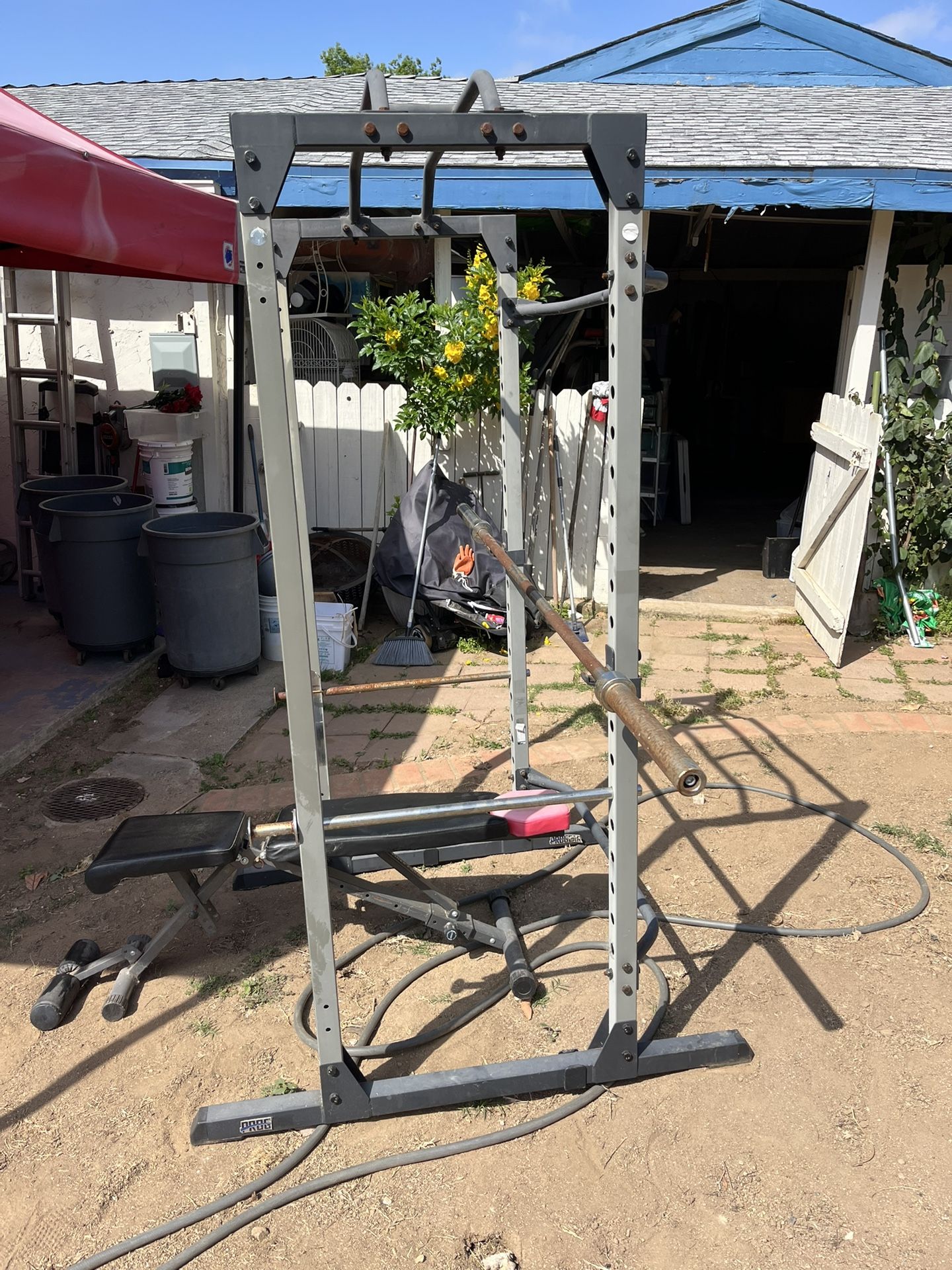 Squat Rack + 45lb Bar + Concrete Weights (