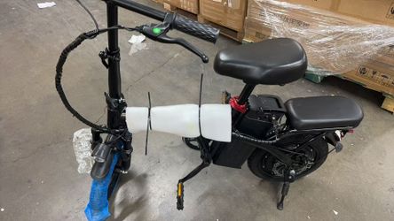 Adult folding electric bike with a 650W motor, 20-30 mile range, and a 48V 13Ah removable battery
