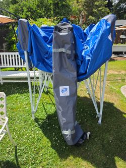 Brand new EZ UP 10 x 10 with case on wheels