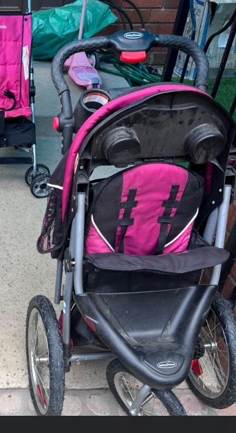 Four Strollers 1 Jogging, 1 Bassinet, 2 Umbrella 