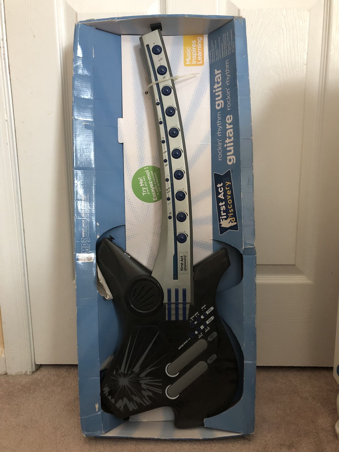 A Kids guitar, Toy Story Carryon, And Kid’s Fish Wall Decoration.