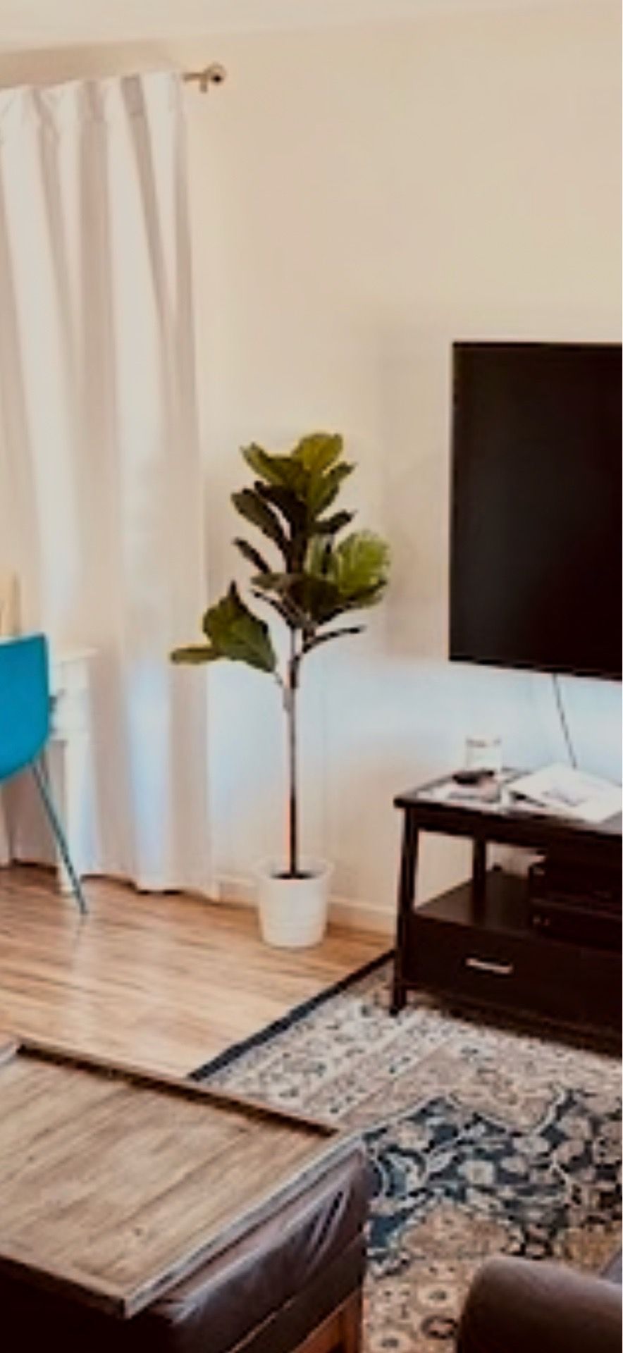 Faux fiddle fig plant and white pot