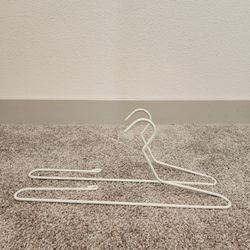 2 - WHITE HANGERS THAT WAS USED FOR TABLE LINEN (21.5" long)