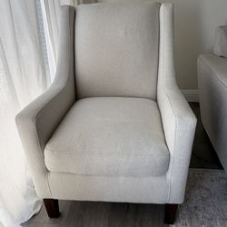 Studded accent chair cream color with brown legs