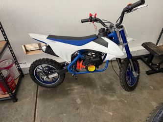 Kids Mini Dirt Bike Gas Powered Chinese 50 cc in good condition used a few times starts right up perfect for any kids