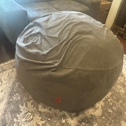 Cordaroy bean bag chair that converts into a full-size bed.