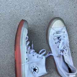 White converse with a colorful sole 