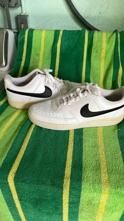 Nike White Low-Top Sneakers with Black Swoosh