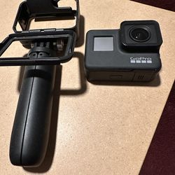 GoPro HERO7 Black with a tripod and an original case