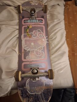 complete Girl Skateboards setup featuring a rare pink/purple limited edition Hello Kitty deck