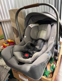 Nuna baby car seat with base and also an attachment to put on stroller