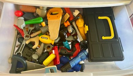 Tote full of toy tools. 25451 Boxelder dr 92563