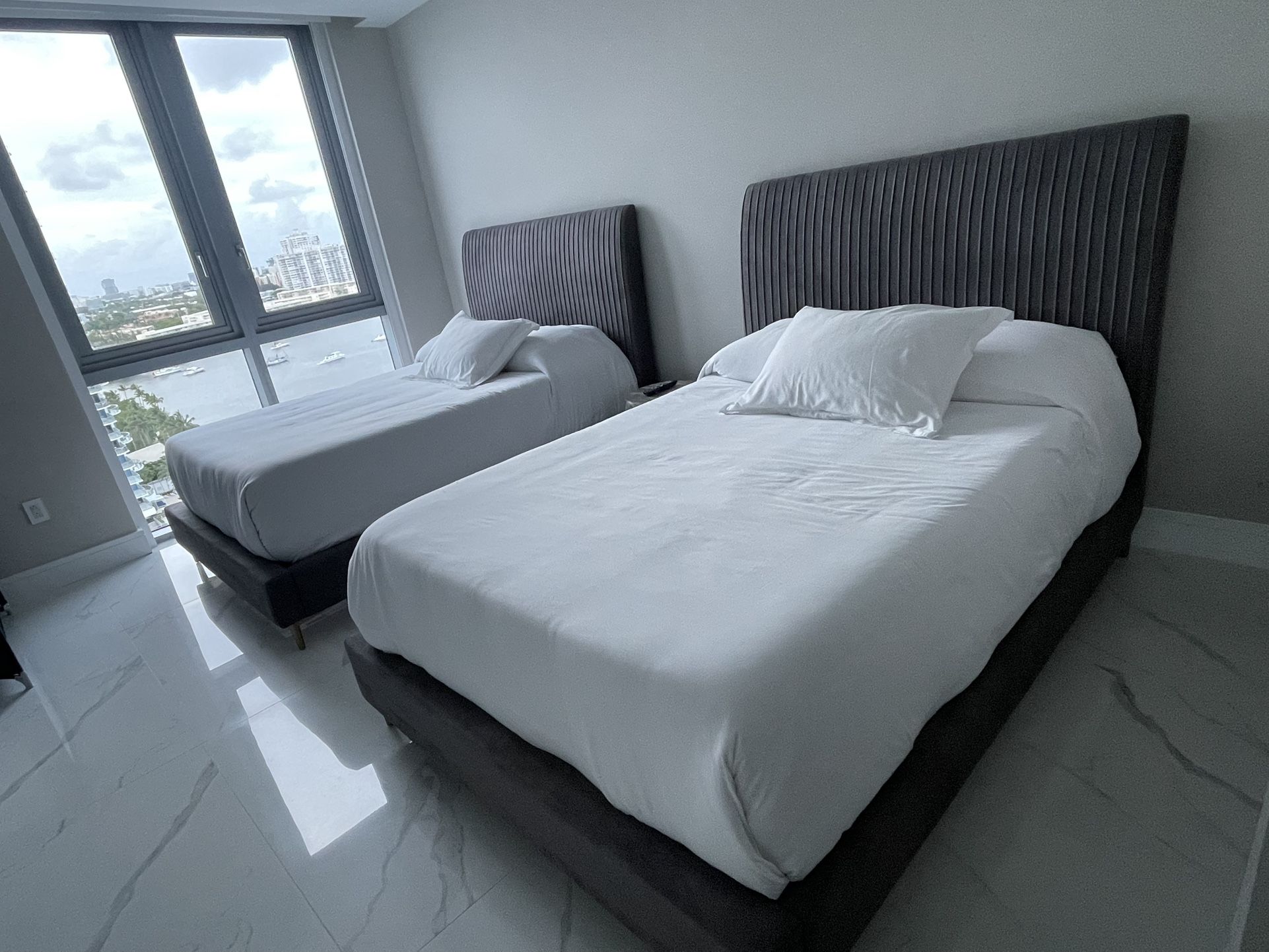 TWO NEW BED FRAMES WITH MATTRESS AND PILLOWS