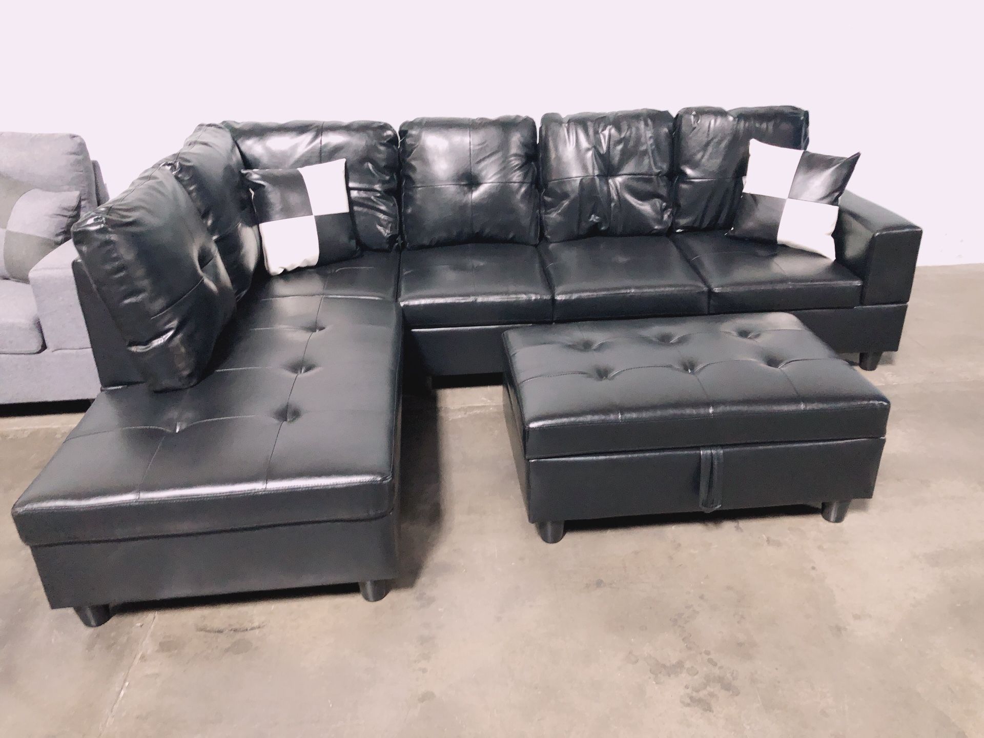 Black sectional couch with ottoman 