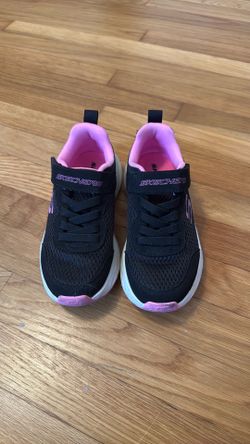 Pink and black Skechers