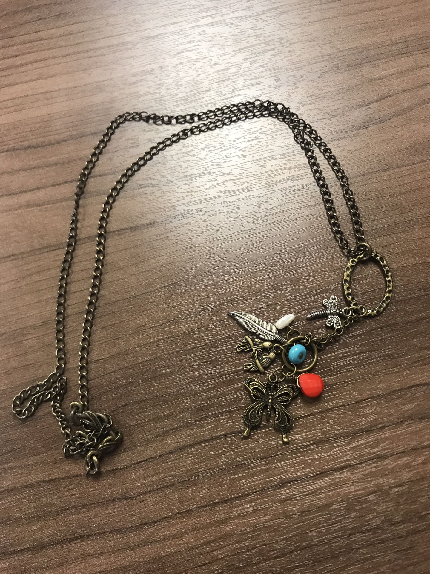 Handmade necklace with butterfly and feather