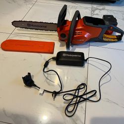 Husqvarna electric 14” chainsaw comes with battery and charger like new asking $200 thanks 