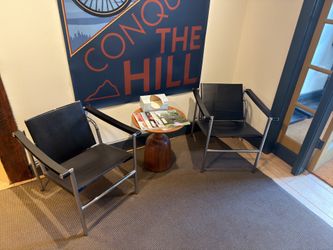 Pair of Le Corbusier LC1 Basculant Chairs — Black Leather & Chrome