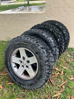 Used 4 BFGoodrich All-Terrain T/A LT 255/75 R17 tires with Jeep rims