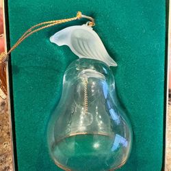 Lenox crystal partridge bell ornament. The crystal bell features a frosted partridge on top and gold trim around the base. The ornament was produced a