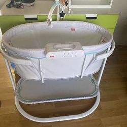 Baby Bassinet Cribside Also Has Lights That Go On Celling And Vibrating 