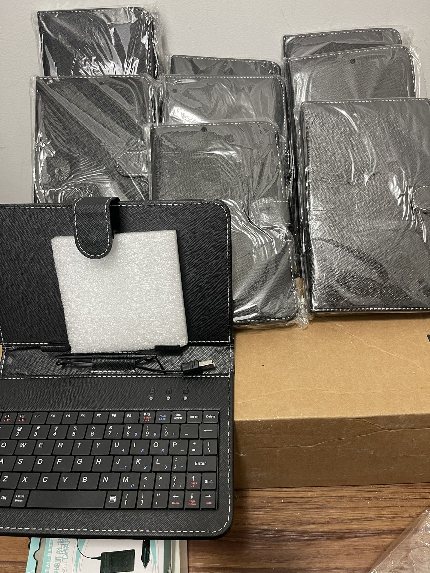 9 Pieces 7” Tablet Case With Keyboard In New Condition $45 For All Firm On Price