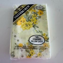 pillowcases set new in package unopened Yellow floral with greenery on a light yellow background I have two pkgs available $10 each